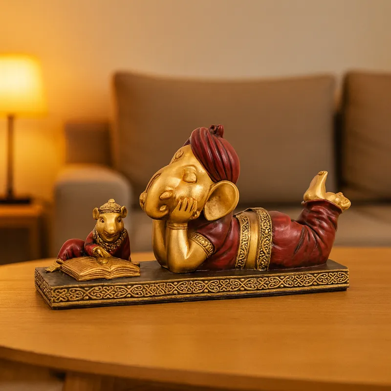 Sleeping Lord Ganesha Reading Book Showpiece – Resin Ganpati Idol for Home Décor